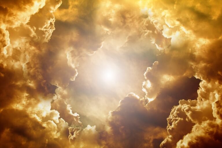 smoke filled sky with sunshine peeking through